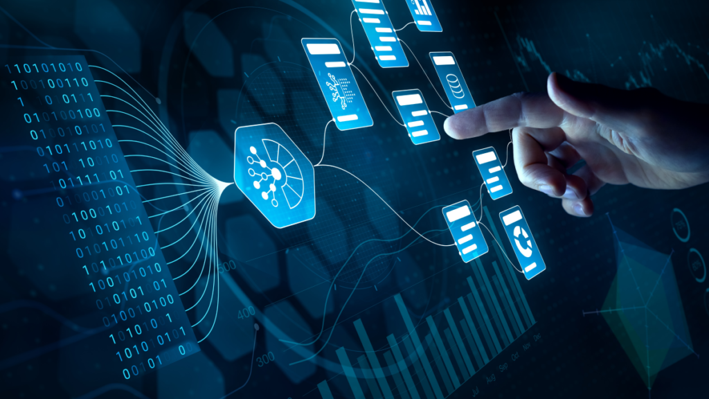 Hand pointing to a diagram and charts on screen with a blue hue